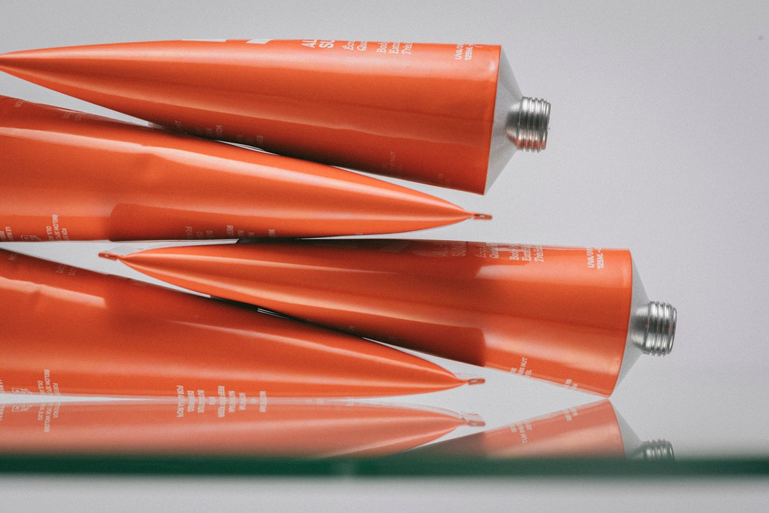 EVERYDAY SUNSCREEN SPF50 ORANGE TUBES STACKED ON TOP OF EACH OTHER